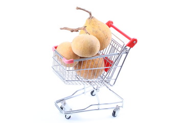 Santol in shopping cart isolated on white