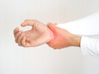 rheumatoid arthritis and repetitive motion injuries,including carpal tunnel syndrome in woman and she touching on her wrist and symptoms of pain and swelling in the hand use for health care concept.