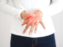 Rheumatoid Arthritis And Repetitive Motion Injuries,including Carpal Tunnel Syndrome In Woman And She Touching On Her Wrist And Symptoms Of Pain And Swelling In The Hand Use For Health Care Concept.