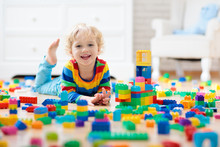 Child Playing With Toy Blocks. Toys For Kids.