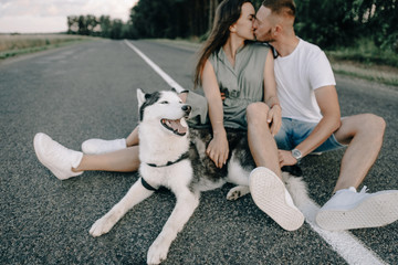 Wall Mural - Portrait of happy senior couple in park with dog