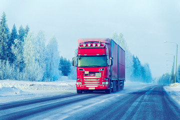 Canvas Print - Truck at Snow Road in winter Lapland in Finland