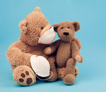 Large Teddy Bear In A White Mask Transfers The Accessory To Another, Concern For The Health Of Those Who Are Exposing