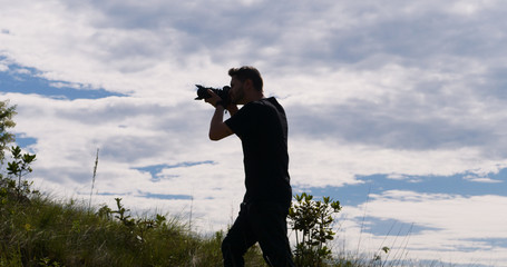 Wall Mural - Man taking pictures, Serra da Canastra National Park