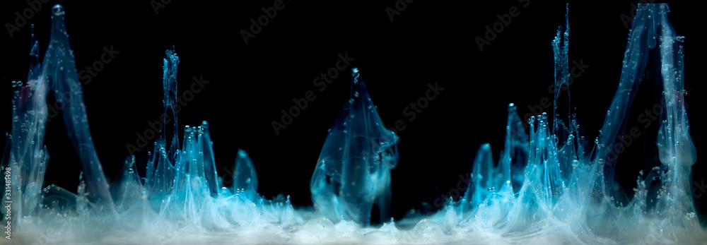 Blue ink in water on a black background - obrazy, fototapety, plakaty 