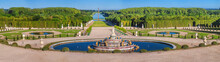 Panoramic View Of The Versailles Park - The Latona Basin With The Grand Canal In The Background Under The Summer Sun, Versailles, France