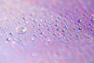 Wall Mural - water drops on dvd media, water drops on colorful background