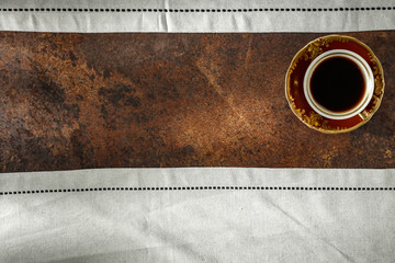 Sticker - Old retro cup of warm black coffee  seen from above. Coffee with dark brown grunge background. Copy space. Space for advertising products.