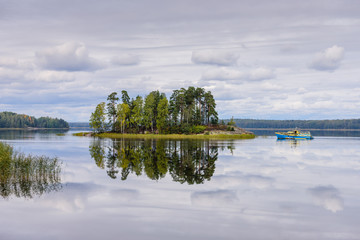 Wall Mural - Picturesque lake with an island. Sightseeing of Vyborg, Leningrad region, Russia. Monrepo Park is a picturesque natural Park in Vyborg. Beautiful autumn view