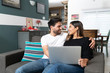 © AntonioDiaz - Smiling Latin Couple With Laptop At Home