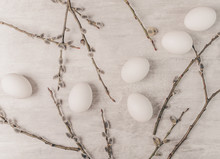 Easter White Eggs And Willow Branches On Grey Wooden Table, Rustic Style