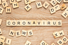 The Words "Coronavirus News" Spelt Out With Letter Tiles On The Wooden Background