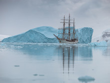 Sailing Expedition Ship In Antarctica Surrounded By Ice And Ice