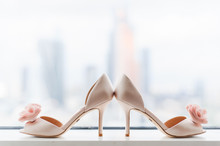 Rows Of Beautiful, Elegant Women's Shoes On Store Shelves. Elegant Beige Wedding Shoes For The Bride At The Window 