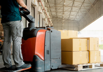 Poster - Worker courier driving electric forklift pallet jack loading the goods.  packaging boxes, warehouse delivery service customers shipment  transport.