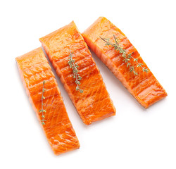 cooked salmon fillet on white background