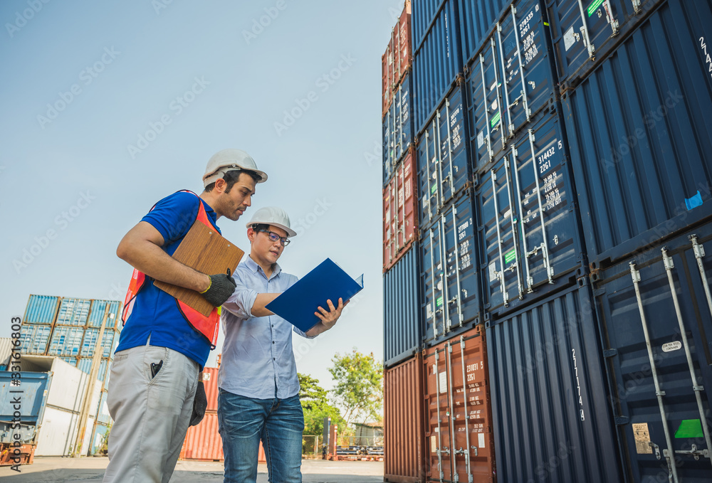 Foreman and dock worker staff working checking at Container cargo harbor holding clipboard. Business Logistics import export shipping concept. - obrazy, fototapety, plakaty 