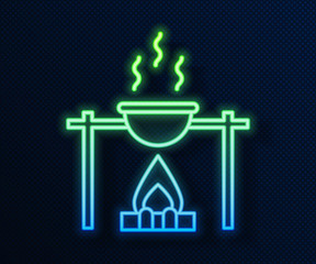 Sticker - Glowing neon line Campfire and pot icon isolated on blue background. Fire camping cooking in cauldron on firewood and flame. Vector Illustration