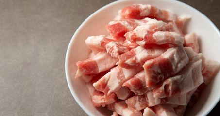 Poster - Fresh raw pork in white bowl