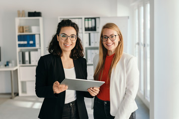 Two happy relaxed young businesswoman