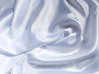 white crumpled fabric texture background. Silk curtain with fold waves for design