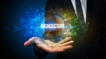 Elegant hand holding ARCHITECTURE inscription, digital technology concept