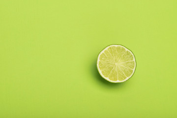 Poster - Lime slice on green background