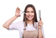 © LumenSt - Young woman in apron isolated on white background. Hairdresser concept