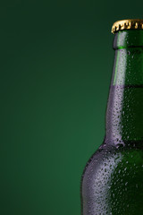 Wall Mural - Beer bottle on gradient green background