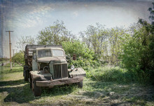 Old Rusty Truck On The Green Spring Rural Field