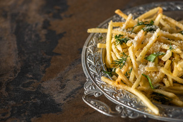 Wall Mural - selective focus of salty french fries on marble surface