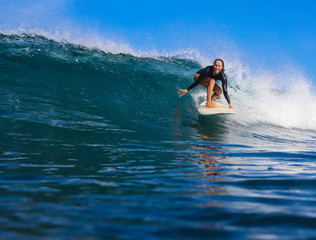 Female surfer on a wave