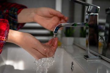 washing hands in bathroom