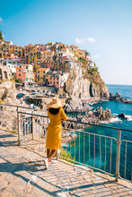 Woman Visit Manarola Village, Cinque Terre Coast Italy. Manarola Is A Beautiful Small Colorful Town Province Of La Spezia, Liguria, North Of Italy And One Of The Five Cinque Terre National Park