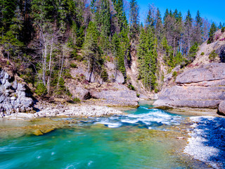 The smallest location of the steam cutoff in the george of the river Ammer with turquoise water in bavaria, called Scheibum