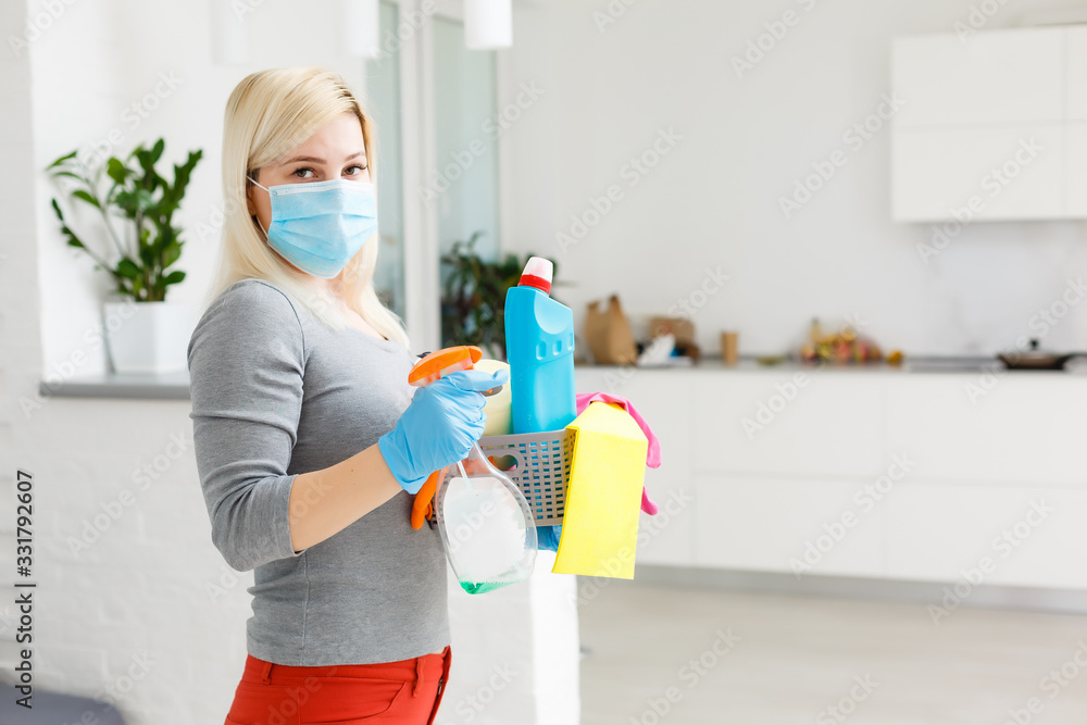 Cleaning and Disinfection at town complex amid the coronavirus epidemic. Professional teams for disinfection efforts. Infection prevention and control of epidemic. Protective gloves and mask - obrazy, fototapety, plakaty 