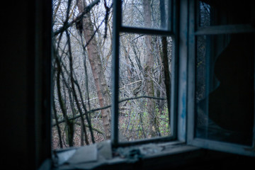 Old windows in the house in Pripyat in Chernobyl