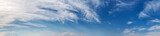 Fototapeta Na sufit - Panorama sky with beautiful cloud on a sunny day. Panoramic high resolution image.