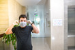 © Dung - Asian man wearing medical mask at office. Wuhan China coronavirus (COVID-19) outbreak prevention. Health care and medical concept. Protection against virus, infection, exhaust.