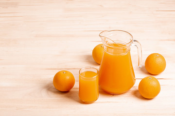 glass and jar of fresh orange juice