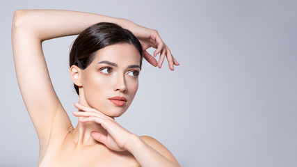 Wall Mural - Portrait of beautiful brunette woman with clean skin of face  - isolated on white. Photo of an Young girl with light natural eye makeup. Beauty face of young woman with healthy fresh skin.