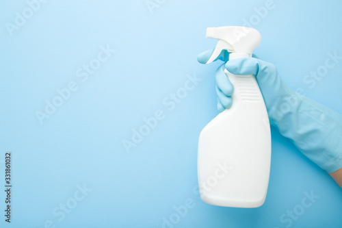 Cuadros en Lienzo Hand in rubber protective glove holding white spray bottle