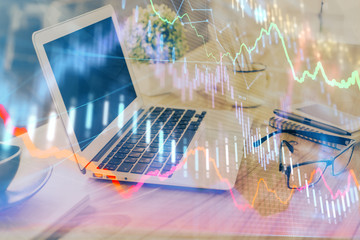 Forex market chart hologram and personal computer background. Double exposure. Concept of investment.