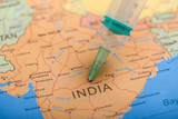 Fototapeta  - corona virus concept , Indian map marked with syringe