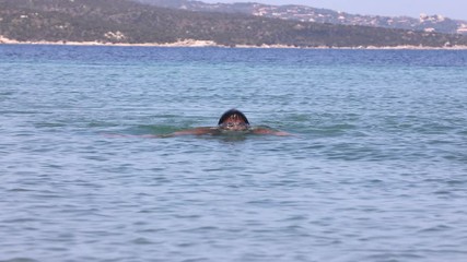 Wall Mural - Young man swimming in the sea (swimmer, triathlon)