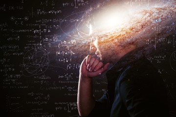 Wall Mural - science about nature and about man, pensive man with space in the brain and physical and mathematica