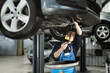 © smishura - Close up hands of unrecognizable mechanic doing car service and maintenance. Oil and fuel filter changing. New fuel cartridge,oil, dust, engine filter