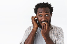 Embarrassed And Worried Bearded African-american Guy Feel Panic, Biting Nails And Scratch Ear, Stare Camera Anxious, Making Mistake Or Fault, Facing Consequences, Standing Ambushed White Background