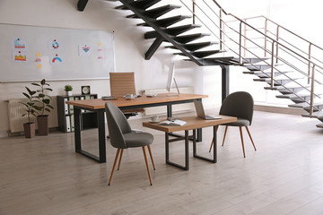 Wall Mural - Stylish office interior with large wooden table