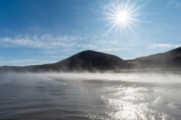 Wall Mural - Sunrise over a foggy beach at Pendulum Cove, Deception Island, Antarctica